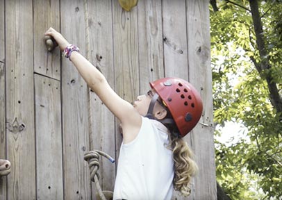 Girl on climbing wall